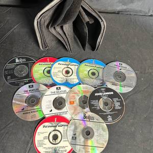 lot 293 image: The Beatles Compact Disc Lot of 11 Discs With Zippered CD Case