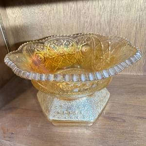 lot 372 image: Two-Piece Amber Iridescent Glass Set Hexagonal Base Spittoon-Shaped Bowl and Patterned Dish
