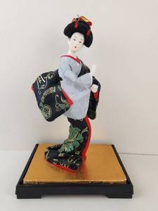 lot 108 image: Vintage Geisha Doll Kimono Figurine with Black and Gold Display Stand