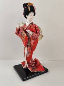 lot 109 image: Vintage Geisha Doll Figurine with Red Kimono on Black Base