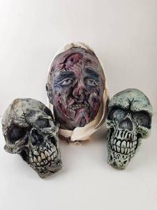 lot 309 image: Halloween Zombie Head and Two Skull Props Lot of 3