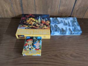 lot 29 image: Puzzle Lot 550-Piece Jigsaw and 24-Piece Disney Jake and the Never Land Pirates