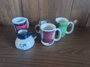 lot 69 image: KMUW 89.1 Mug and Pitcher Lot U.S. Army Clear Mug 5 Pieces