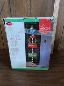 lot 126 image: Home Elements Solar Holiday Lamp Post 55 in H