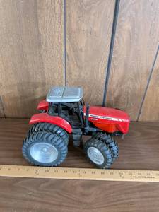 lot 174 image: Massey Ferguson Dyna-Step Toy Tractor 8480 The front piece that controls the tires on one side is broke
