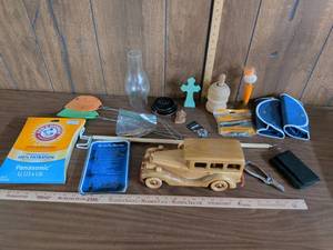 lot 186 image: Mixed Household Lot Arm & Hammer Panasonic UU3U6 Vacuum Bags, Durabelt Belts, Wooden Car