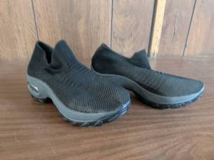 Pair of Black Knit Slip-On Shoes with Platform Sole and Visible Air Cushion Window