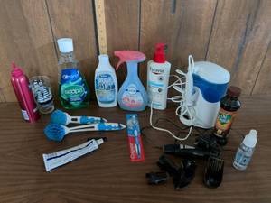 lot 200 image: Household and Personal Care Lot Waterpik Water Flosser, Trimmer, Scope, Colgate