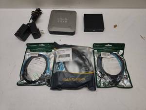lot 54 image: Cisco SD2005 5-Port 101001000 Switch with D-Link DGS-105 and Accessories Lot