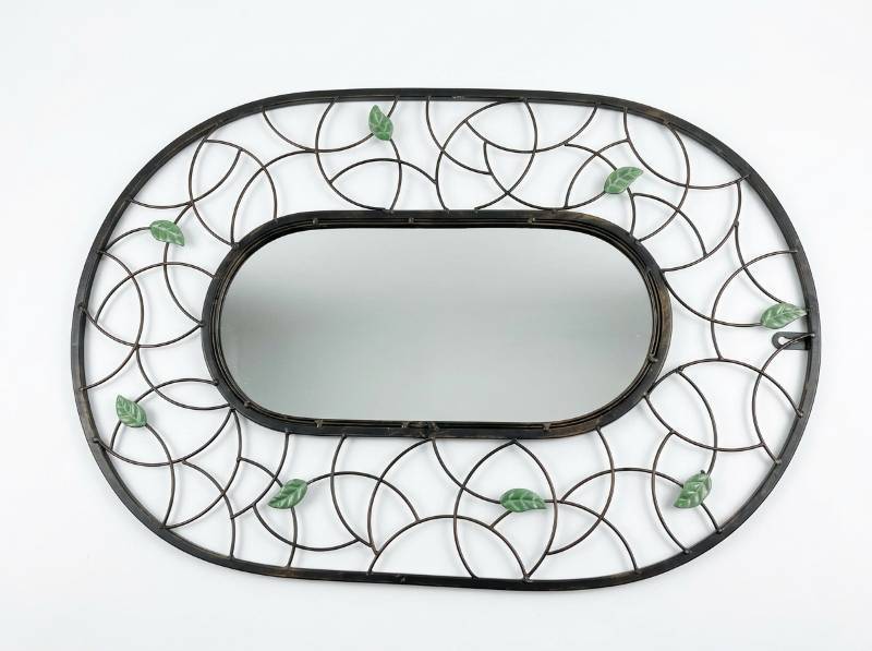 lot 4067 image: Oval Wall Mirror with Leaf-Patterned Metal Frame
