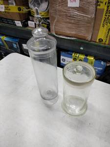 lot 8228 image: Set of 2 Clear Glass Apothecary Jars w Lids, Tall Footed Jar & Short Jar