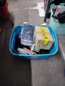 lot 8247 image: Mixed Lot TV Wall Mount, Food Container, Backpack, DVDs, Looney Tunes Figure & More
