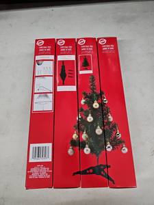 lot 8273 image: Lot of 4 Christmas House 18in Artificial Christmas Trees 11in Dia Boxed