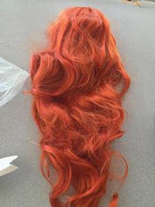 lot 293 image: Vibrant Red Long Curly Wig, Heat Resistant Synthetic Hair Cosplay Wig with Adjustable Cap,Babi Curls Mermaid Hairstyle Wine Red Long Wavy wig for ArielCostumeAnimeParty - Retail $6,063