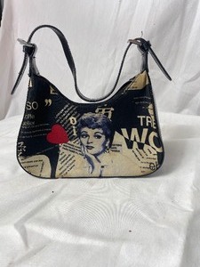 lot 36780 image: LUCY gently used small purse pic of LUCY on both sides of pic. Very cute