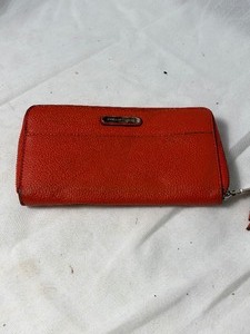 lot 36799 image: gently used red leather dana buckman wallet