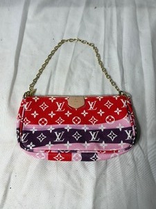 lot 36800 image: gently used multi colored louis vumon small carrying bag