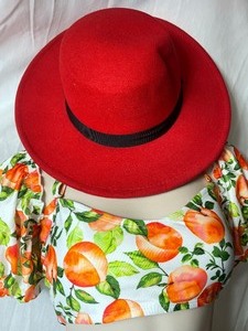 lot 36914 image: Red Wool Felt Fedora Hat With Black Ribbon Style Around The Brim.