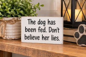 lot 1703 image: Small Wooden Sign The Dog Has Been Fed. Dont Believe Her Lies.