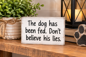 lot 1704 image: Small Wooden Sign The Dog Has Been Fed Dont Believe His Lies