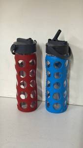 lot 136 image: Lifefactory Water Bottle Lot of 2 Red and Blue with Lids and Straw