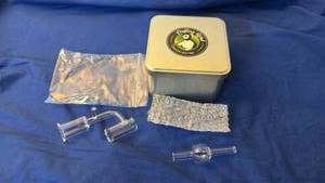 lot 142 image: Puffing Bird Concentrating Glass Angled Banger with Bubble Cap in Tin