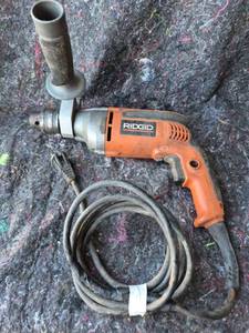 lot 25 image: RIDGID 12 in. Rotary Hammer Drill with Chuck - Powers On