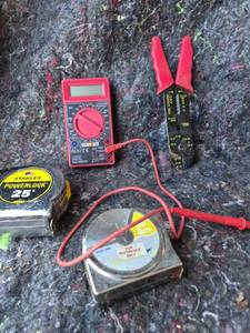 lot 34 image: Digital Multimeter with Test Leads and Measuring Tape Lot