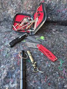 lot 66 image: Knife and Tool Set with Red Storage Case and Keychain Tools - BRASS DOG WHISTLE
