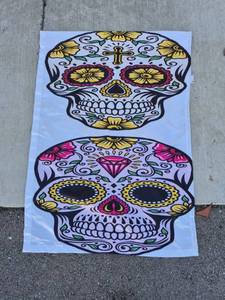 lot 77 image: Skull Design Flag Two Skulls with Floral Decorative Pattern - About 2 Foot by 4 Foot