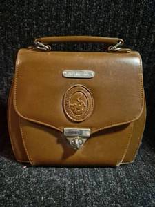 lot 84 image: Polo Ralph Lauren Tan Leather Handbag with Tassel Detail