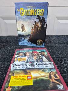 lot 130 image: The Goonies Blu-ray and Board Game Lot with Pirates of the Caribbean DVD