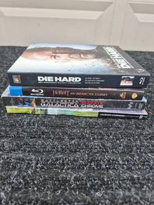 lot 134 image: Blu-ray DVD Lot Die Hard 25th Anniversary, The Hobbit, Battlestar Galactica