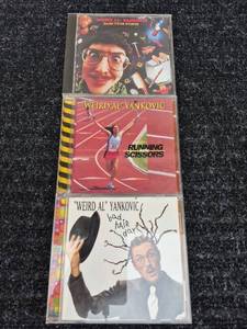 lot 154 image: Weird Al Yankovic CD Lot Dare to Be Stupid Running with Scissors Bad Hair Day