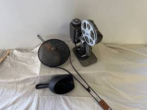 lot 68 image: Antique Items-camp popcorn popper, 8mm movie projector, iron scoop