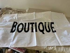 lot 76 image: Boutique vinyl sign with grommets