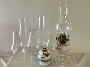 lot 79 image: Vintage finger oil lamp and glass globes
