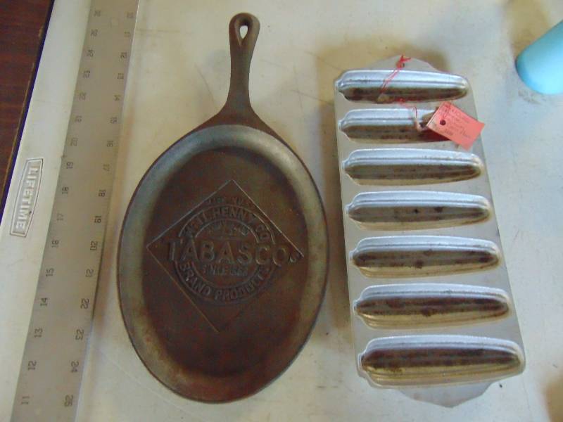 lot 3136 image: Pair of Cast Baking Items - Tabasco and Cornbread