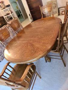 lot 900 image: Dining table 30x72x48 which includes the 24in leaf, 4 side chairs and 2 arm chairs. Table has moisture or heat bubbling spots on top.