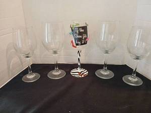 lot 1129 image: Wine Glass Lot of 5, 4 Plain Clear Stemmed and 1 If the Shoe Fits Buy It Design