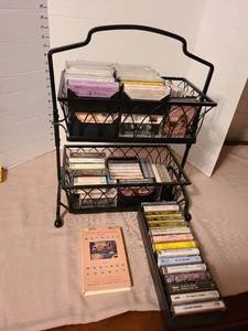 lot 1215 image: Audio cassettes and metal storage holder.