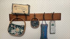 lot 1301 image: Wood with Iron Hooks, Button Pillow, 2 Basket Purses and Fabric Hanging, Irish Sign