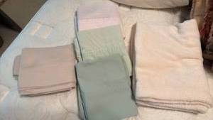 lot 1306 image: Four Matching Pillowcases and One Cream Fuzzy Pillowcase