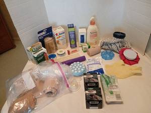 lot 1410 image: First Aid and Personal Care Lot  Band aids, gauze, lotion, dental picks, ice bags, and more