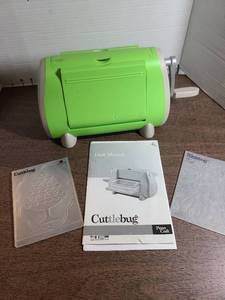 lot 3120 image: Cuttlebug Machine with 5 Embossing Folders and User Manual
