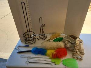 lot 3200 image: Metal toilet and paper towel holders, dusting brushes, hanging bag of clothespans.
