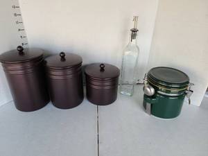 lot 3231 image: Three brown lightweight metal cannisters, stoneware cannister with bail, dispenser jar