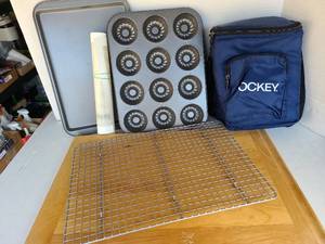 lot 3312 image: Cookie sheet, silicone mat, mini bundt cake pan, cooling rack, wooden cutting board 22x15