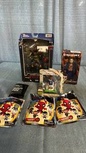lot 2008 image: Assortment of Action Figures and Bag Clips.