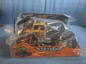 lot 8028 image: Driven 2-in-1 RC Track Truck 2.4GHz Remote Control Sandstorm